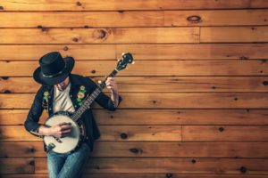 A man playing the banjo