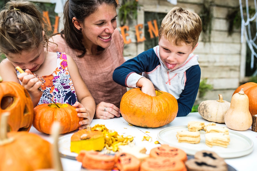 Mother and two children enjoying pumpkins at one of the top autumn events in Nashville.